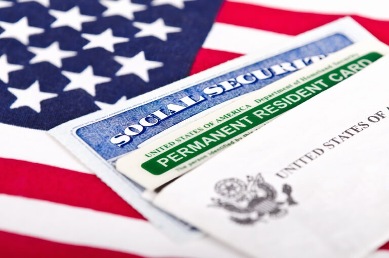 flag-of-the-united-states-america-green-card-immigration-permanent-residence-768x509