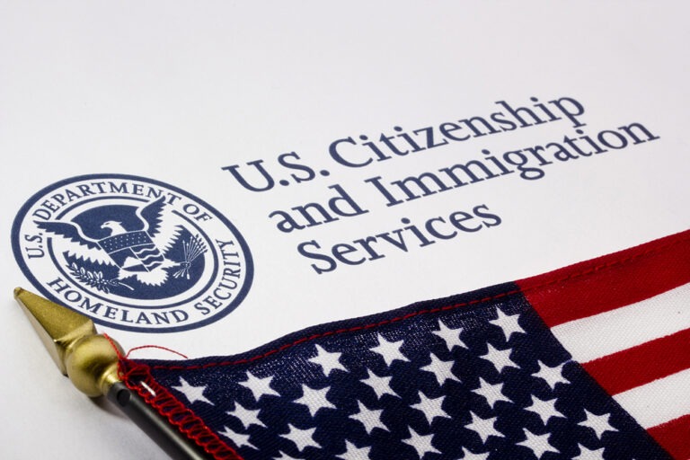 united-states-citizenship-and-immigration-services-letterhead-and-an-american-flag-768x512